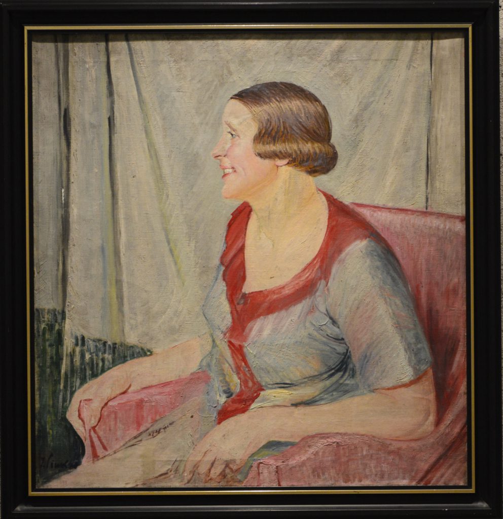 Ignacy Pinkas: "Portret Wł. Kowalskiej". Kobieta w kolorowej sukni, siedząca w fotelu. Olej na płótnie, lata 20.XX w.