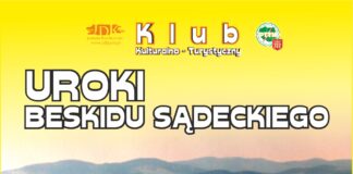 Na tle krajobrazu górskiego znajdują się białe napisy klub kulturalno-turystyczny a po jego bokach logotypy jasielskiego domu kultury po lewej stronie, natomiast po prawej polskiego towarzystwa turystyczno krajoznawczego. Na dole po środku baneru logotyp tojoty