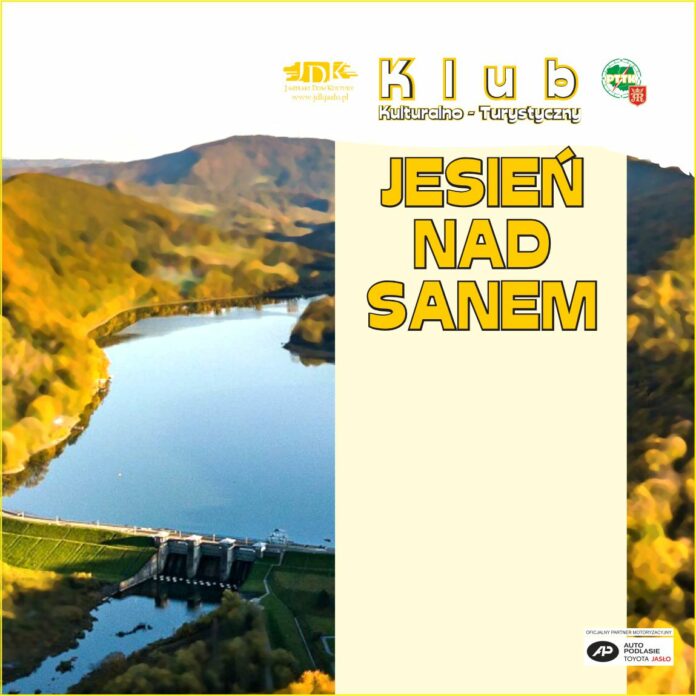 Plakat promujący jesienną edycję Klubu Kulturalno-Turystycznego „Jesień nad Sanem”, z widokiem na zalew otoczony kolorowymi, jesiennymi wzgórzami. W górnej części znajdują się logotypy organizatorów, a w dolnej części po prawej stronie logo partnera motoryzacyjnego.